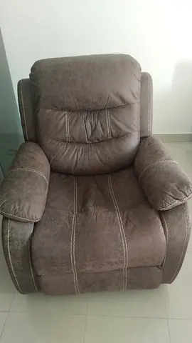 Comfortable single recliner armchair in brown faux leather. Branded. Danube Home