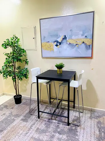 Compact Black Bar Table with Two White Stools — Good Condition