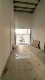 A commercial shop is available for annual rent in Al Rashidiya 1, located directly on the main road