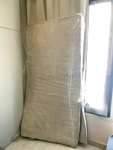 Single foam mattress/cushion 190cm*100cm, wrapped up for dust protection — lightly used