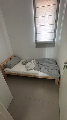 Simple single wooden bed frame with mattress included