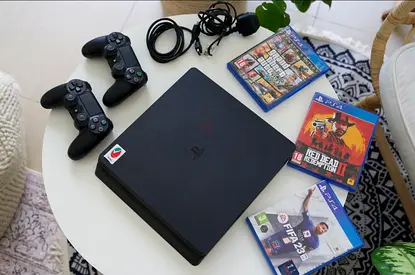 PlayStation 4 Slim with 2 Controllers, Cables and 3 Games (FIFA 23, Red Dead Redemption 2, GTA V)
