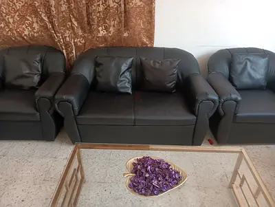 4 one seater and 1 two seater black soaf available in Good condition.  And a tea table
