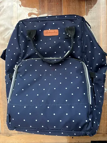 Navy blue polka dot diaper bag backpack