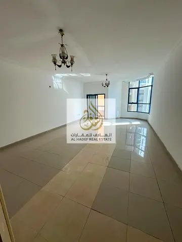 One of the largest apartments in Ajman, with three bedrooms, a living room, four bathrooms, two balconies, a maid's room, a laundry room, built-in war