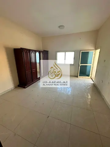 Three rooms and a hall with wardrobes, 2 balconies, 2 bathrooms, near Al-Hikma School