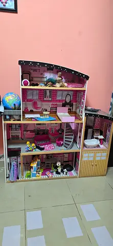 Large wooden dollhouse with furniture