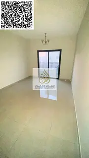 For rent in Ajman, a spacious one-bedroom apartment in Al Jurf 3 with a balcony. Flexible payment op
