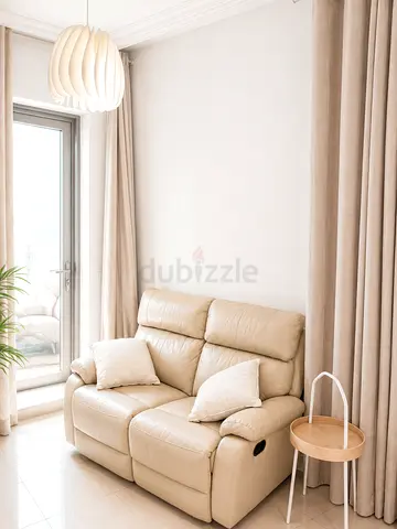 Beige 2-Seater Leather Recliner Sofa - Comfortable, Good Condition