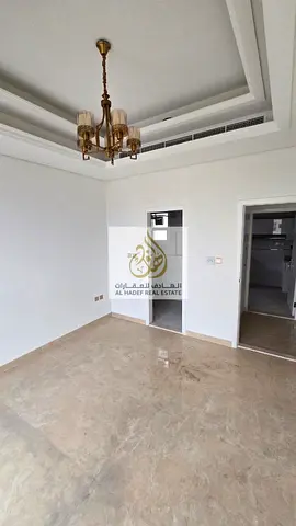 For rent in Al Muwaihat, 3 rooms, a hall, first occupant, 2 bathrooms, a balcony, built-in wardrobes, behind the Saudi German Hospital, with a swimmin