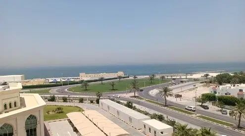 2BR apartment 2 balconies wardrobes store sea view free sandy parking near Al Heera Beach
