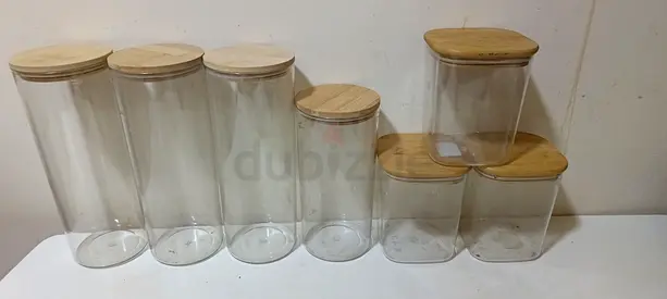 Used Set of 7 plastic Kitchen Storage Jars with Wooden Lids