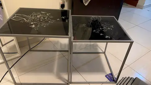 Pair of square glass-top side tables with metal frame