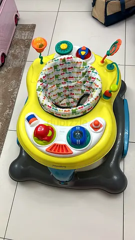 Bright yellow activity baby walker / jumper with removable seat - good condition