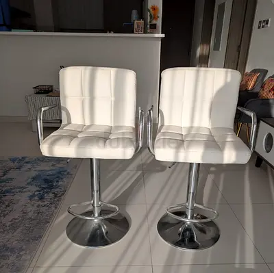 Pair of White Faux Leather Swivel Bar Stools with Armrests