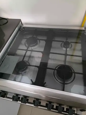 Bompani Stainless Steel 4-Burner Gas Stove with Glass Lid and gas oven - Good Condition