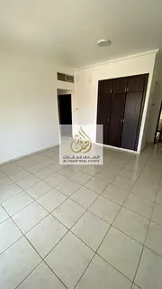 Al Rashidiya 3, near Ajman Towers One - One bedroom, living room, bathroom, balcony, and built-in wa