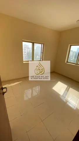 Two bedrooms, a living room, two bathrooms, and a balcony. Located in Al Rashidiya 2, next to Falcon Towers. Annual rent: 32,000 AED. Payment options: