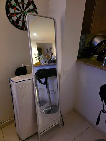 Full-length standing mirror with slim white frame