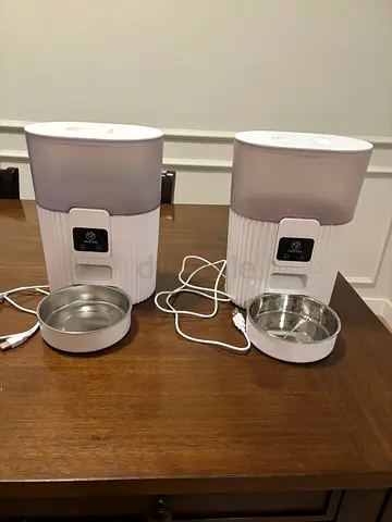 Pair of Automatic Pet Feeders with Stainless Steel Bowls for AED 100 each (Total AED 200 for both)