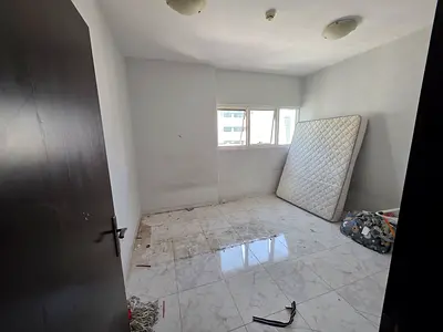 Free parking//near to dubai border //2bhk with close hall//family building