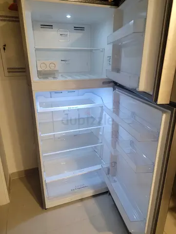 Used double-door refrigerator in good working condition