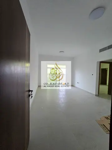 Two bedrooms, a living room, three bathrooms, first occupancy, excellent finishing, one of the largest apartments in Ajman, central air conditioning,