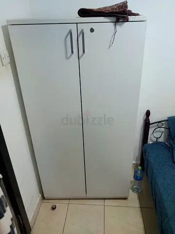 Bed and small cupboard