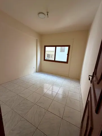 For annual rent in the Al Butina area of Sharjah, a distinctive apartment is located directly behin