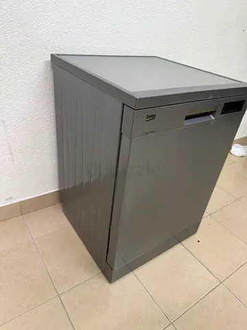 A freestanding dishwasher from Beko, featuring a silver color and modern design.