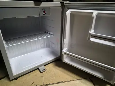 Compact mini fridge with small freezer compartment - good working condition