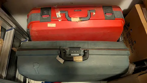 Two vintage hard-shell suitcases (red and green) - good used condition