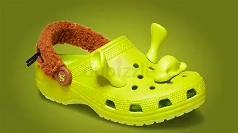 Pair of kids lime green clogs with plush strap (good used condition)