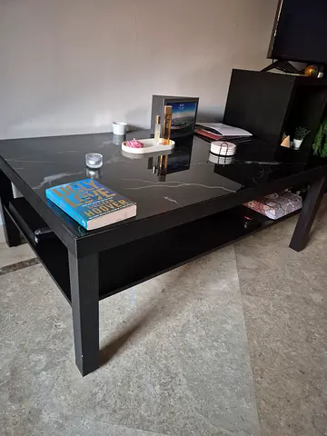 Black wooden coffee table with lower shelf measurements 120cm X 80cm