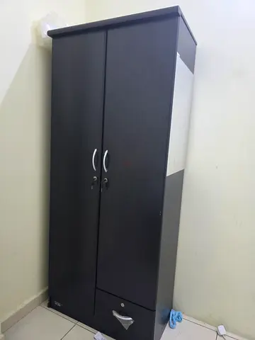 Dark wood two-door storage cabinet / wardrobe with lock