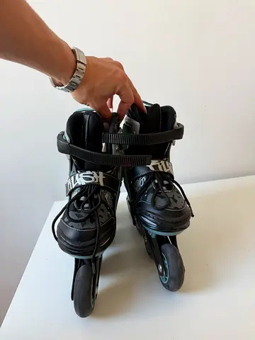 Used black adjustable inline skates - size adjustable, good condition