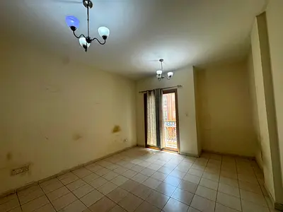 1BR Apartment | Spain Cluster S-06 | Balcony & Street View