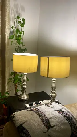 Pair of silver bedside table lamps with beige shades
