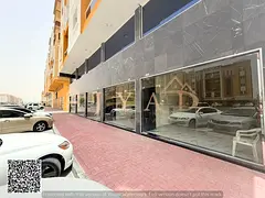 Shop for annual rent in Al Muwaihat 3 on a main road. AED 85,000 yearly, 4–6 payments, security ch