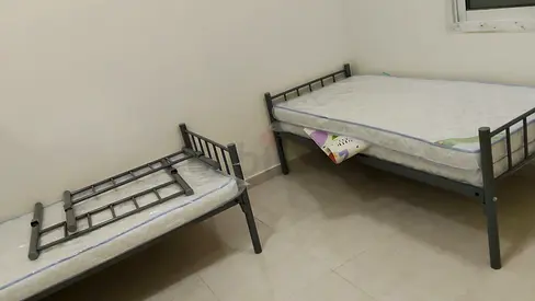 Three metal single beds with mattresses - good condition