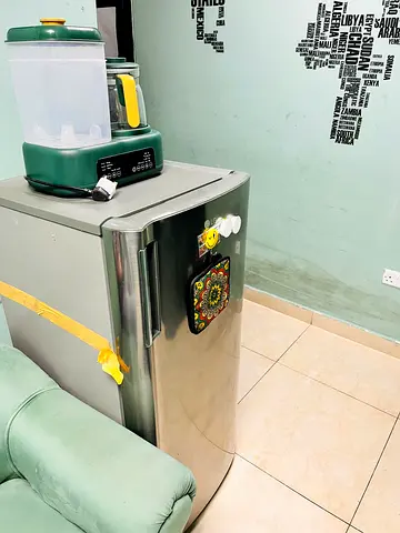 Small stainless steel single-door refrigerator - good condition