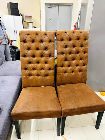Pair of tufted high-back dining chairs in brown suede