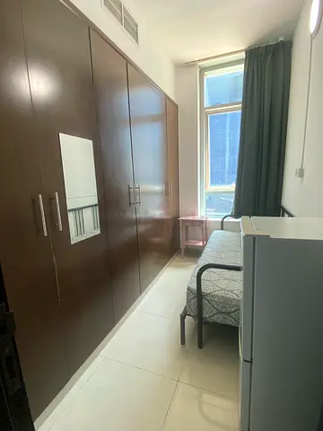 Single room with open window and big wardrobe near metro station