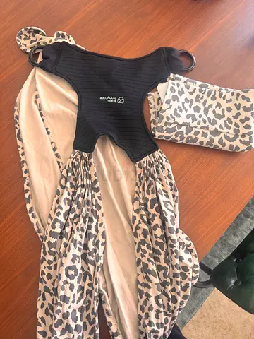 Baby wrap carrier sling with leopard print - gently used