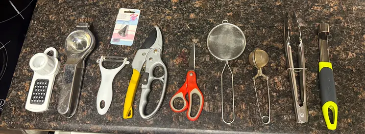 Kitchen utensil and gadget bundle — peelers, tongs, scissors, skimmer, can opener, grater