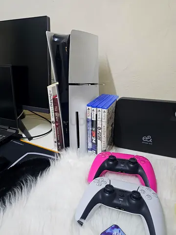 PS5 Console with Two DualSense Controllers and 5 Games - Good Condition