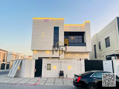 A villa on the main street, ready to move into, with all electricity, water, and air conditioning included, in one of Ajman's most prestigious areas.