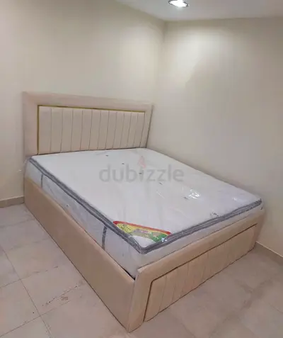 Beige Upholstered King Bed with Headboard and Storage Base