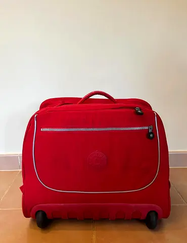 Red wheeled travel bag / small roller suitcase