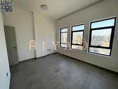 Annual rent: 2BR apartment in Al Alia, Ajman, free month on signing, balcony, built-in wardrobes, ce
